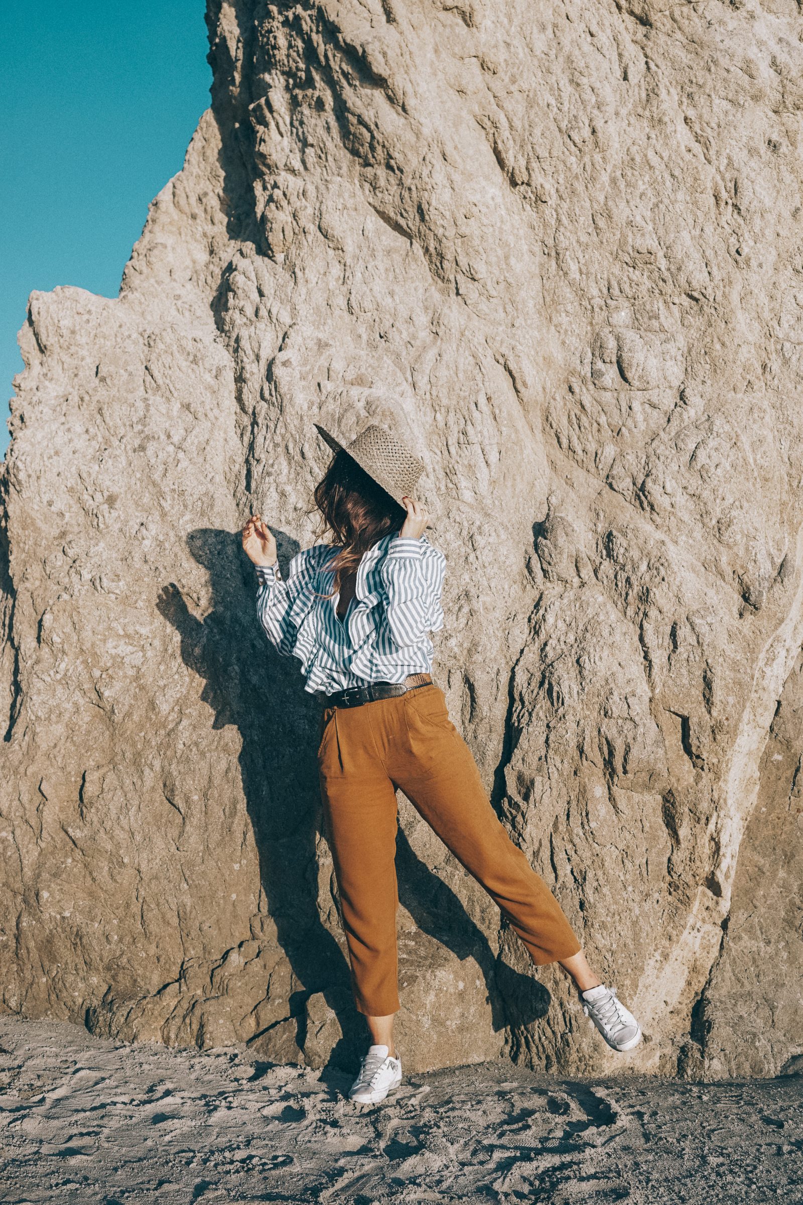 stripped_blouse-camel_trousers-lack_of_color_hat-wanderlust_jewels-matador_beach-malibu-golden_goose_sneakers-street_style-collage_vintage-111