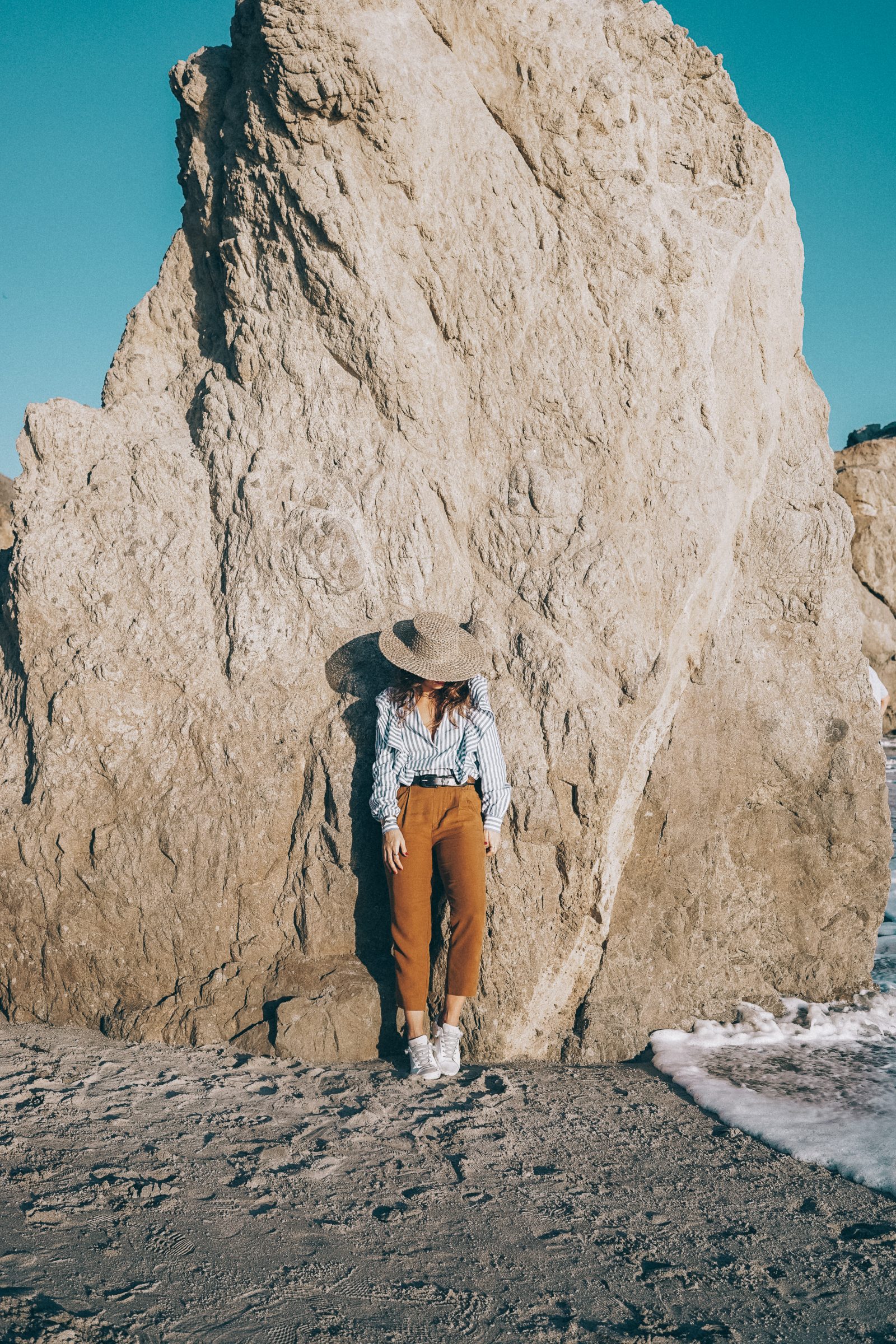 stripped_blouse-camel_trousers-lack_of_color_hat-wanderlust_jewels-matador_beach-malibu-golden_goose_sneakers-street_style-collage_vintage-117